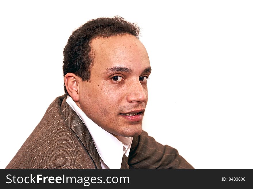 Serious looking african american male wearing dress shirt and pinstriped suit coat against white background looking over shoulder