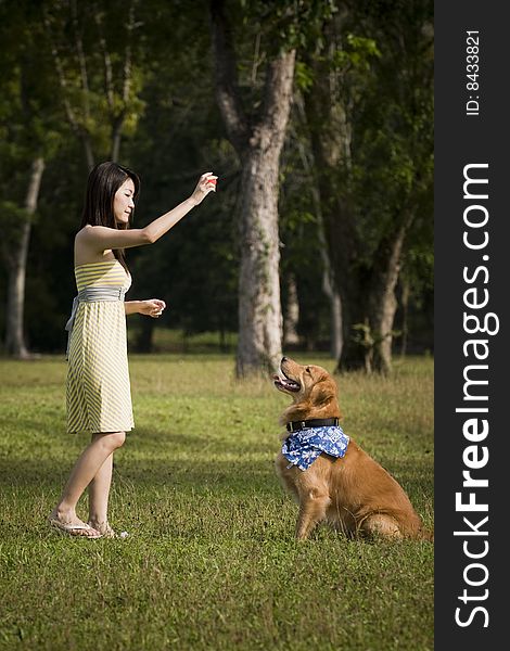 Girl With Dog Playing Outdoor