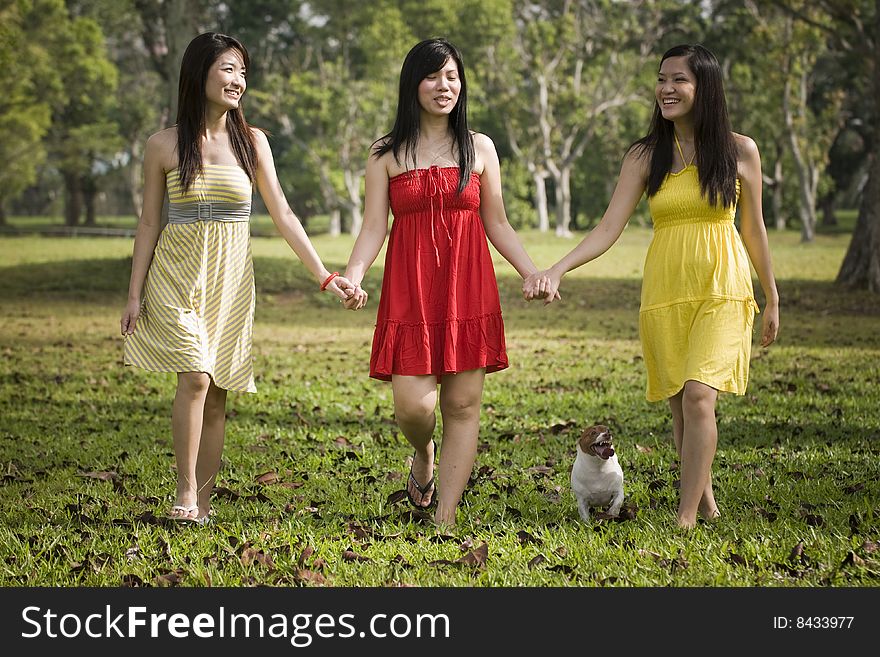 Girlfriends having some happy time together in the park. Girlfriends having some happy time together in the park