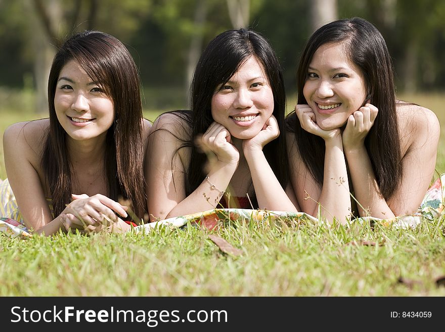 Girlfriends having some happy time together in the park. Girlfriends having some happy time together in the park