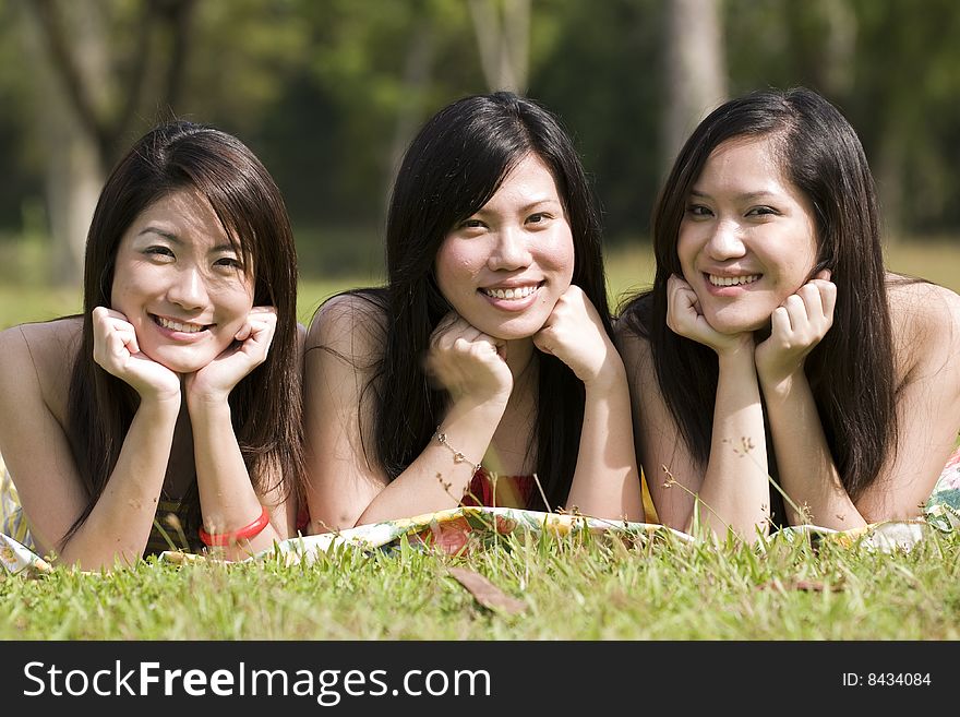 Girlfriends having some happy time together in the park. Girlfriends having some happy time together in the park