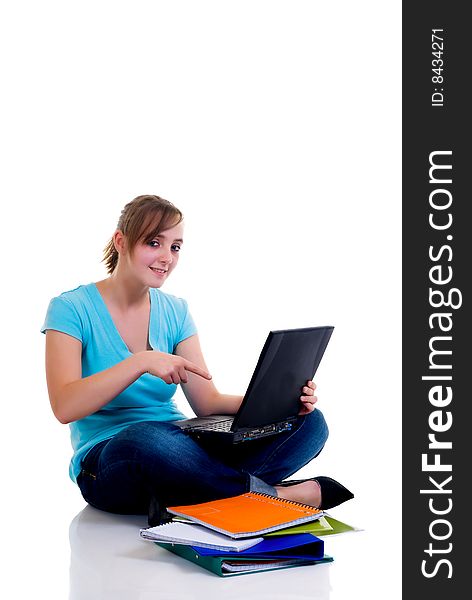 Teenager schoolgirl with laptop on white background