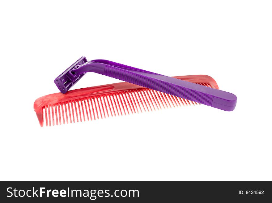 Hairbrush and the razor isolated on a white background. Hairbrush and the razor isolated on a white background