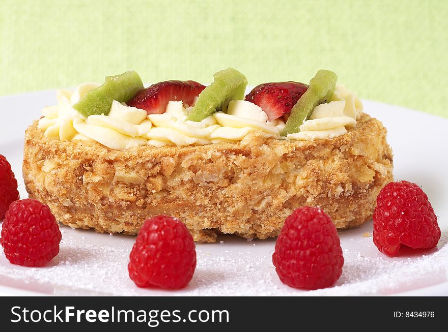 Fruit boat cake with raspberries