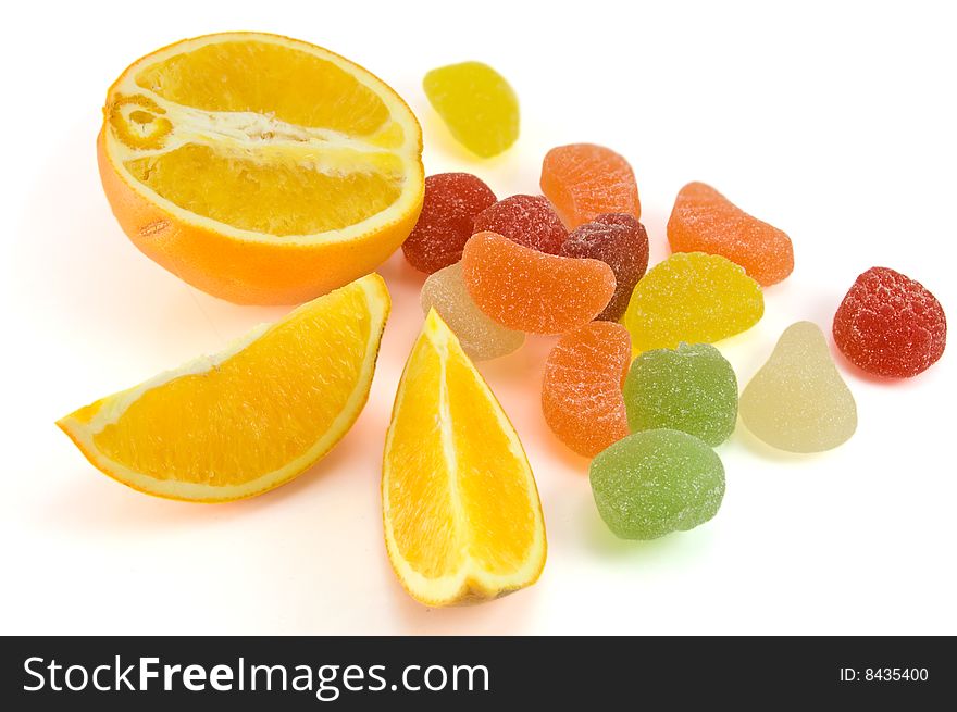 Fruit candy and orange isolated on white background