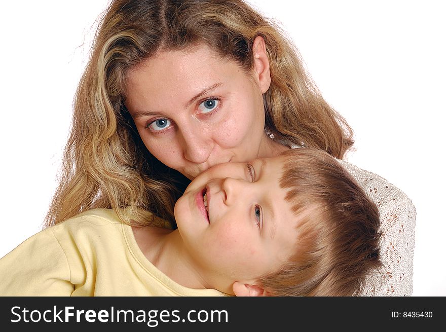 Portrait of a family. Mother kissing her son. Portrait of a family. Mother kissing her son.