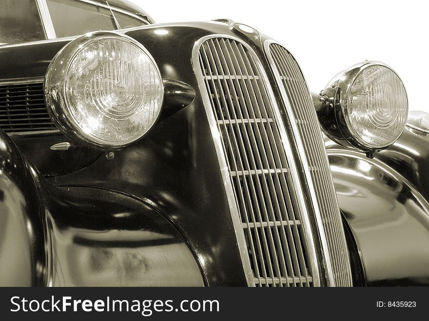 The front of antiquarian car isolated over white with clipping path. The front of antiquarian car isolated over white with clipping path.