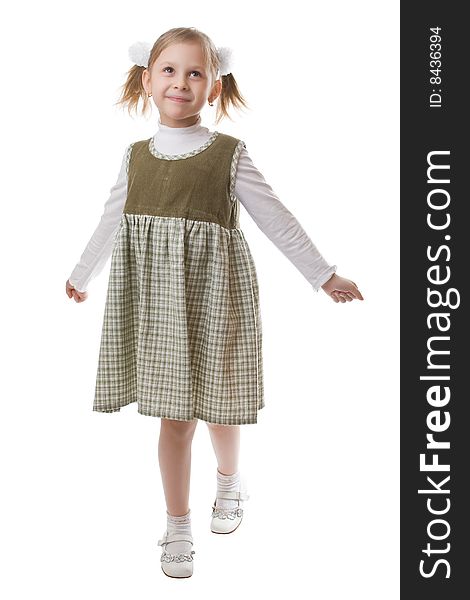 Little beautiful schoolgirl isolated on a white background. Little beautiful schoolgirl isolated on a white background