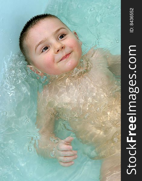 Happy and playful child is bathing. Happy and playful child is bathing