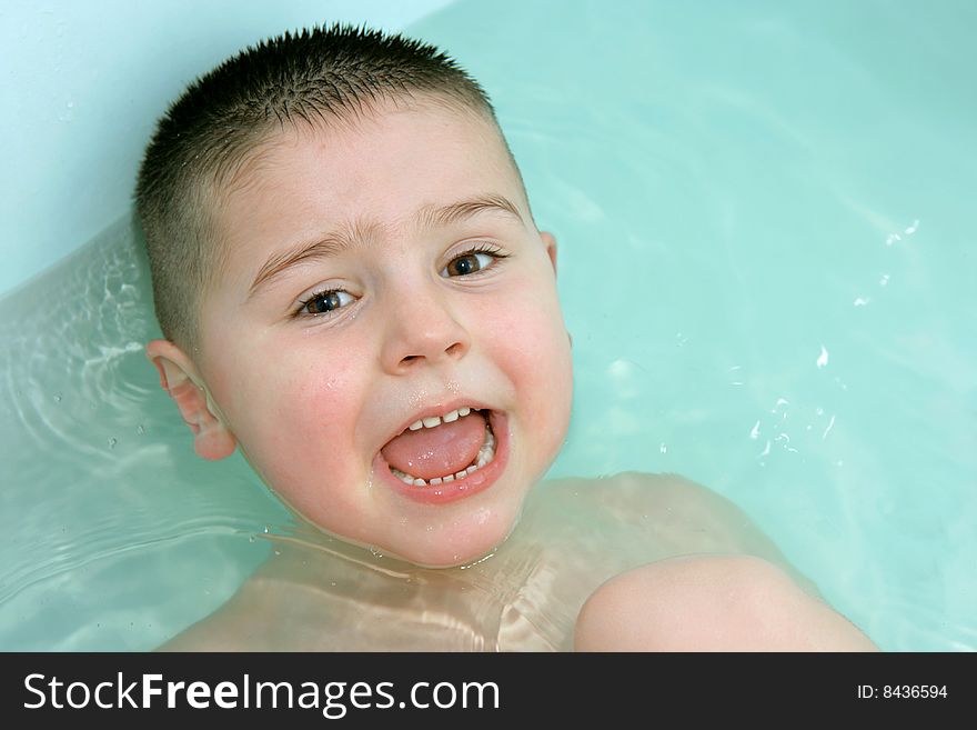 Happy and playful child is bathing. Happy and playful child is bathing