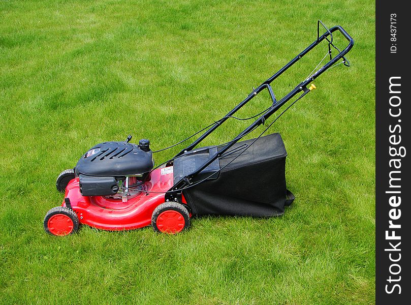 Lawn mower in the  grass