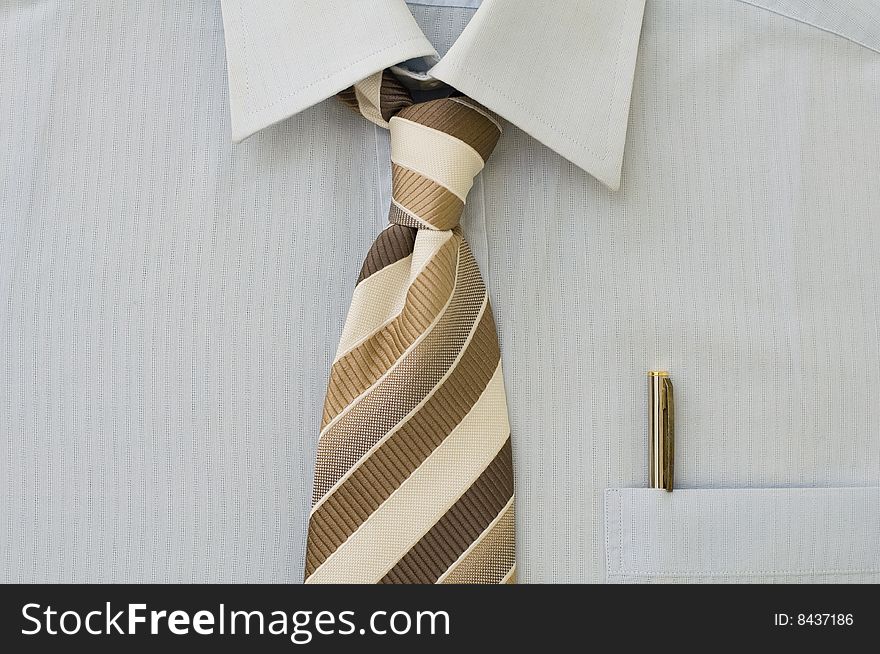 Freshly ironed shirt with pen in pocket and tie. Freshly ironed shirt with pen in pocket and tie