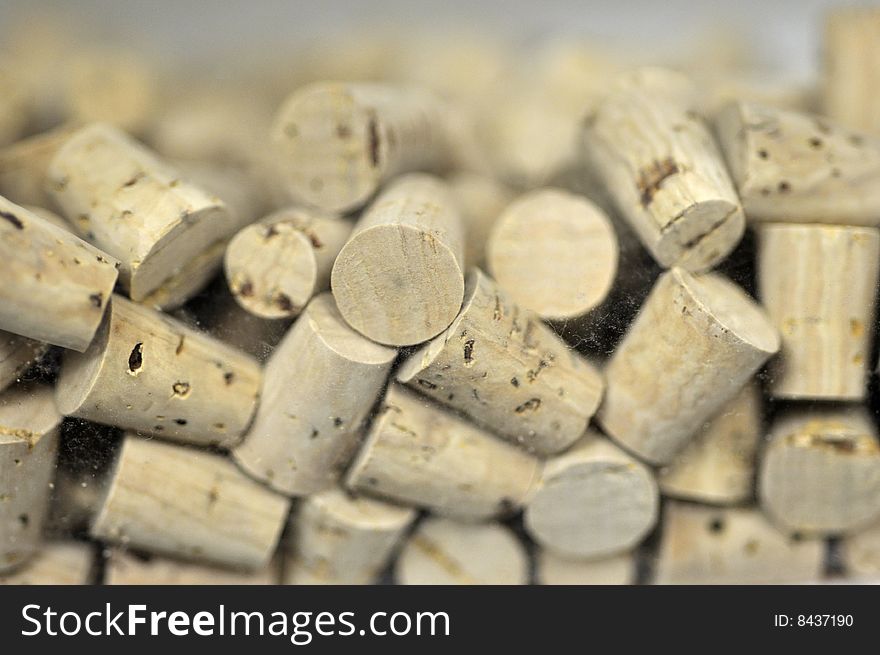 Many corks in a plastic container