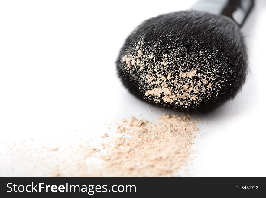 Powder and black brush isolated on white