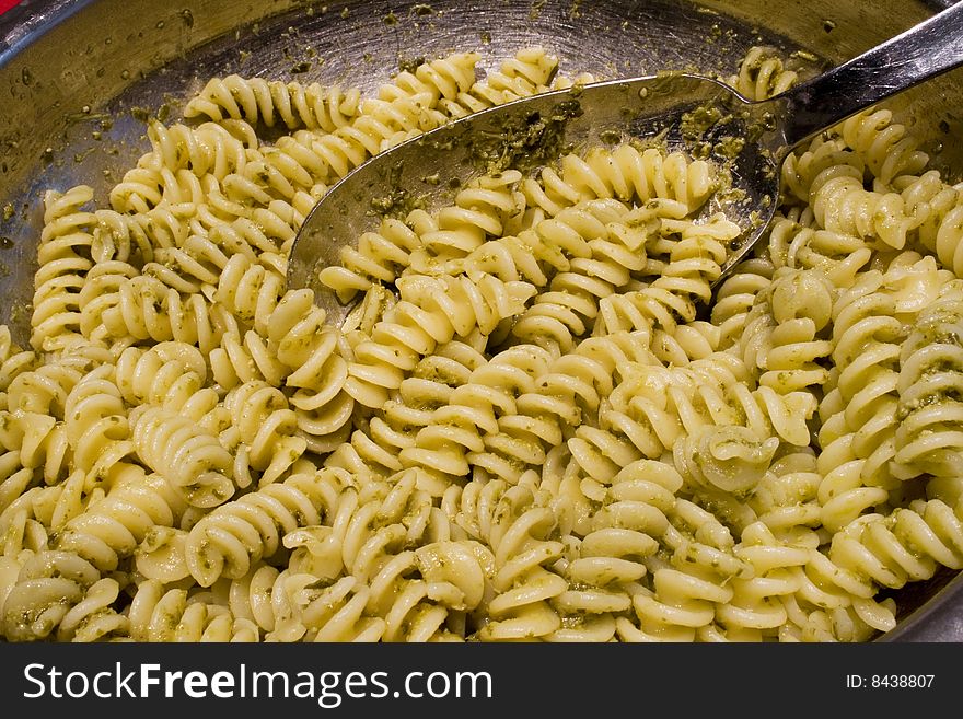 Italian recipe: pasta with pesto sauce. It is made with basil, pine nuts and garlic. Italian recipe: pasta with pesto sauce. It is made with basil, pine nuts and garlic.