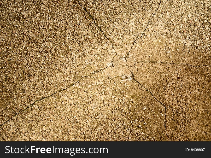 Stone texture on cracked grunge concrete