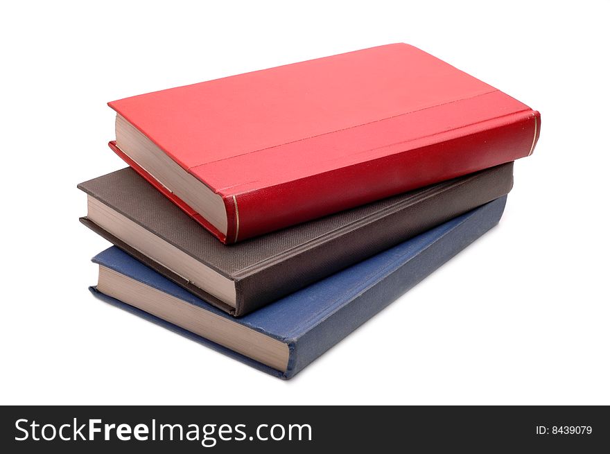 Red, brown, blue books on white background