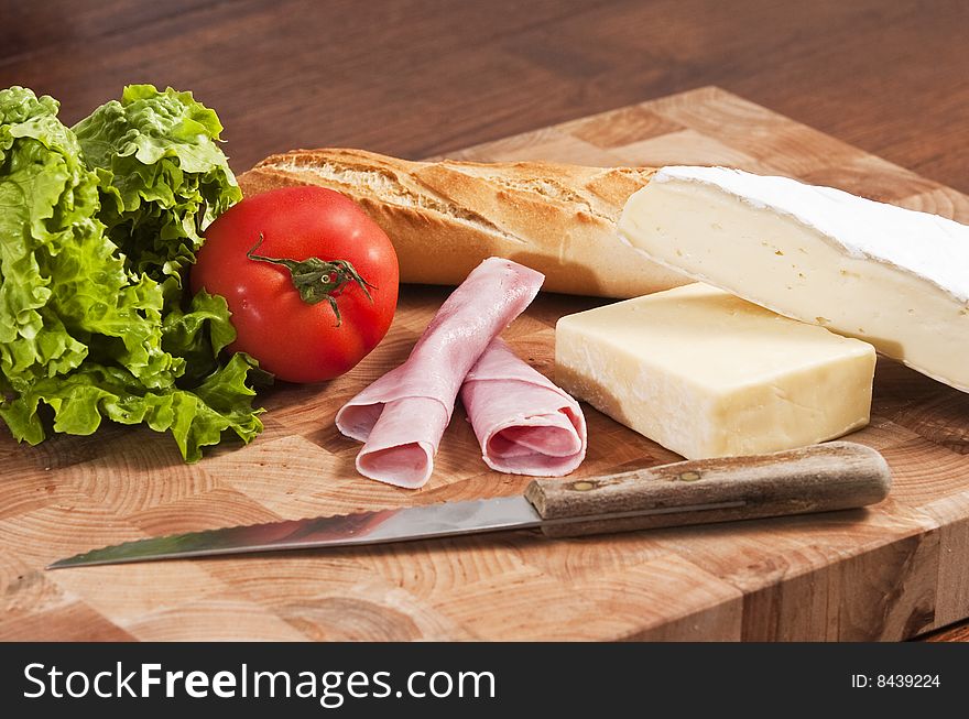 Rustic french baguette with ham and cheese. Rustic french baguette with ham and cheese