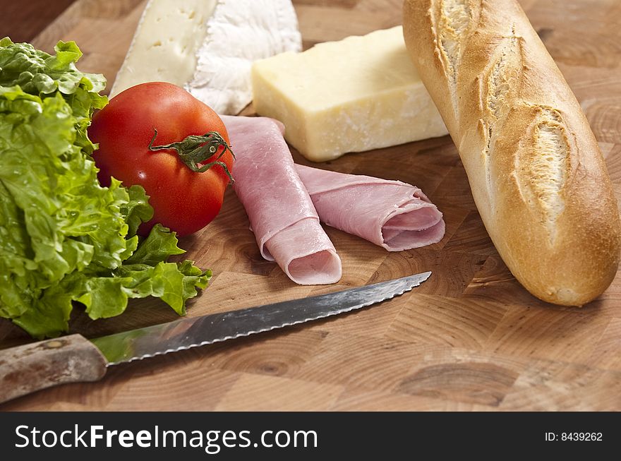 Rustic french baguette with ham and cheese. Rustic french baguette with ham and cheese