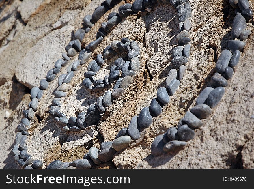 Spiral stone pattern made of small pebbles. Spiral stone pattern made of small pebbles