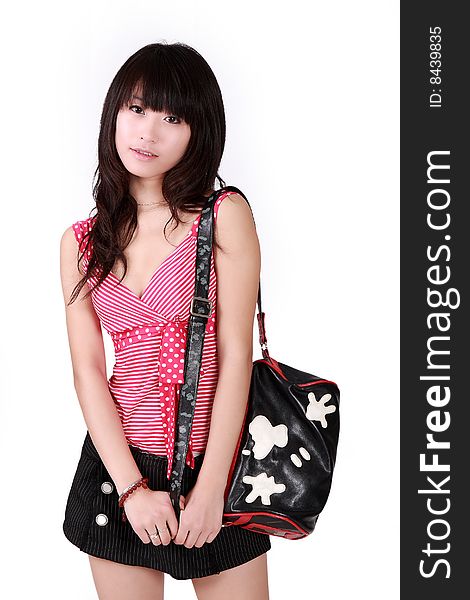 A beautiful Asian girl with handbag on white background.