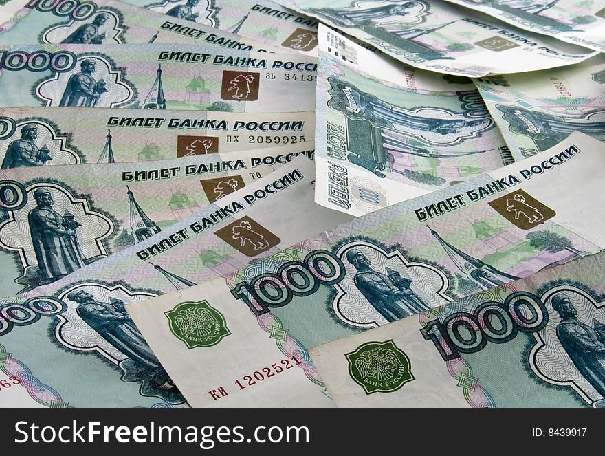 Russian one thousand roubles bills scattered as background