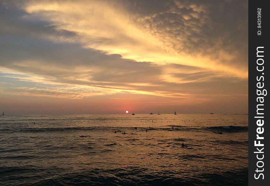 Sunset above Pacific Ocean - View from Waikiki Wall in Honolulu on Oahu Island, Hawaii.