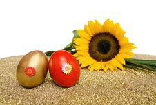 Easter Red And Golden Eggs With Sunflower Royalty Free Stock Photos