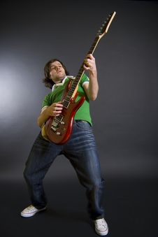 Passionate Guitarist Playing His Electric Guitar Royalty Free Stock Photos Passionate Guitarist Playing His Electric Guitar Royalty Free Stock Photos