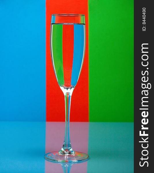 One Wineglass On Color Background