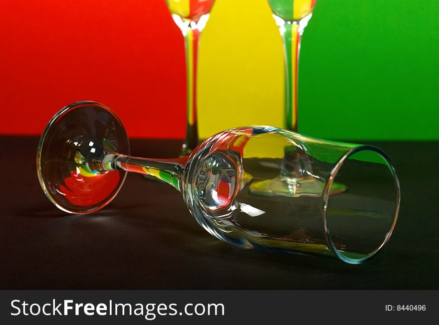 Three wineglass on color background