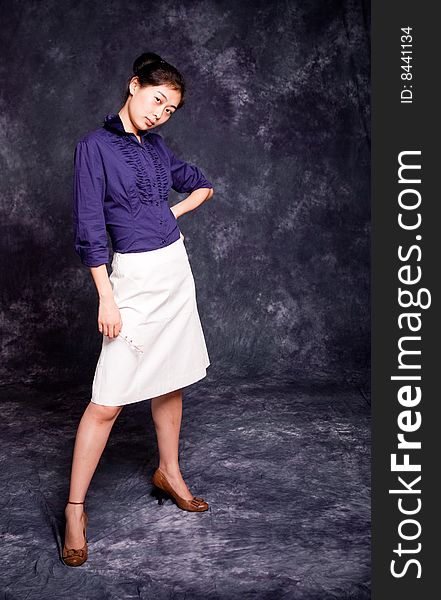 Chinese office lady in purple shirt and white skirt