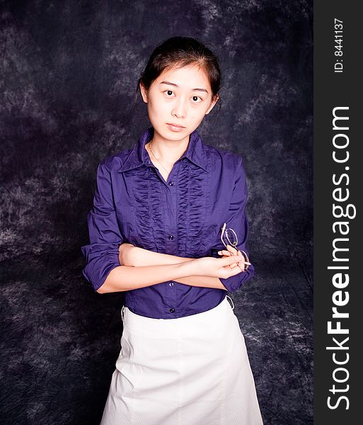 Chinese office lady in purple shirt and white skirt