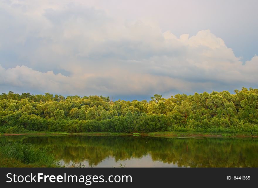 Cloudscape landscape on summer river. Cloudscape landscape on summer river