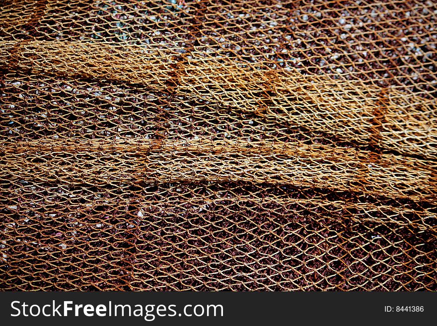 Close view of apile of some fishing net on the docks.