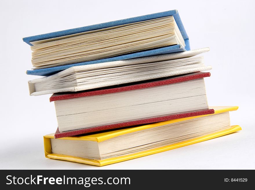 Isolated books stack on the desk