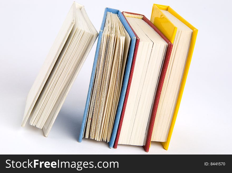 Isolated books stack on the desk