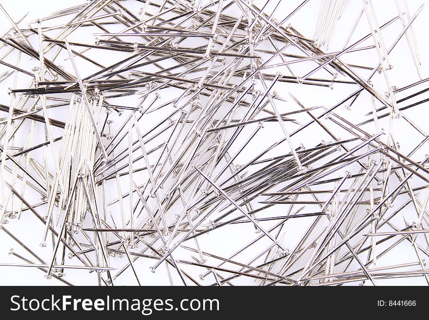 A stack of pins on white background