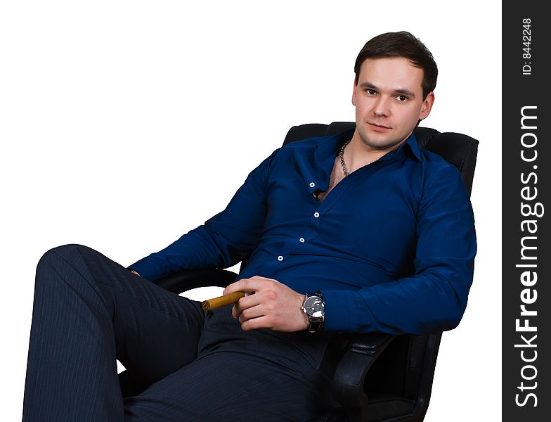 Businessman in armchair isolated over white with clipping path