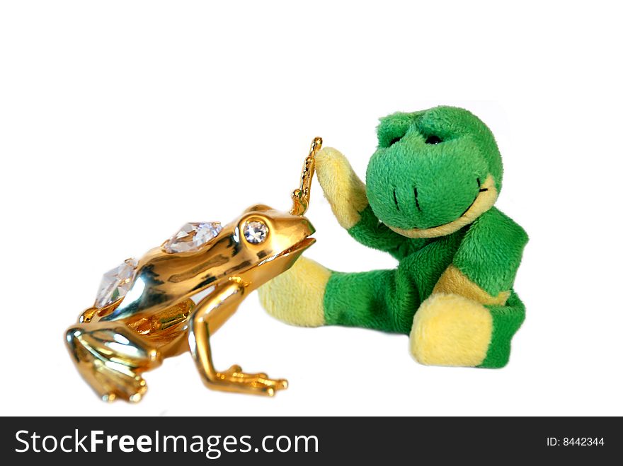 Fun frog with it's gold friend isolated on a white background. Fun frog with it's gold friend isolated on a white background