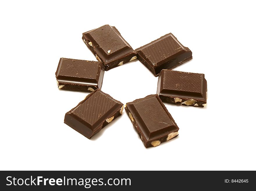 Six segments of chocolate on a white background