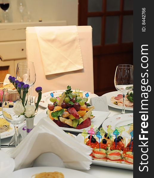 Wedding table and empty chair with decoration in fine restaurant with food served in plates. Wedding table and empty chair with decoration in fine restaurant with food served in plates