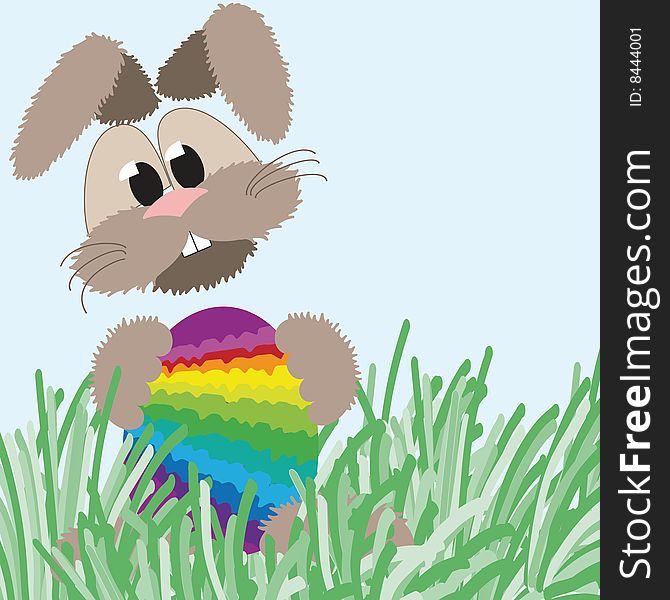 Happy fluffy easter bunny holding an colorful easter egg in rainbow colors. Happy fluffy easter bunny holding an colorful easter egg in rainbow colors