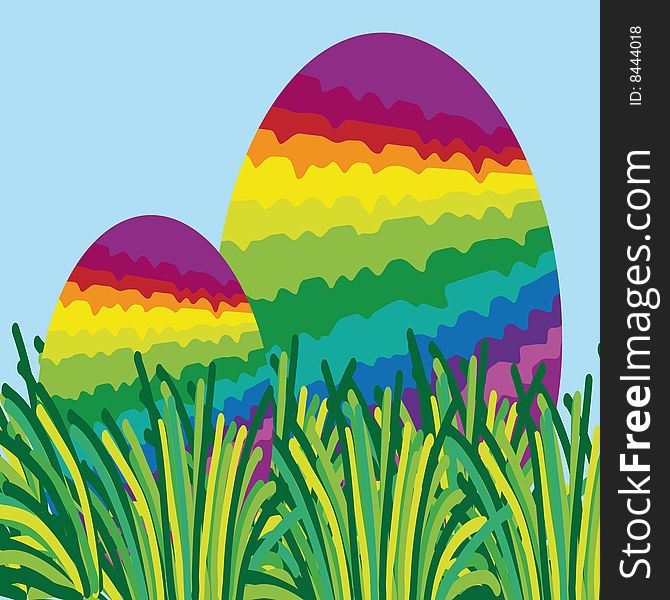 Two rainbow colored easter eggs hidden in the grass. Two rainbow colored easter eggs hidden in the grass