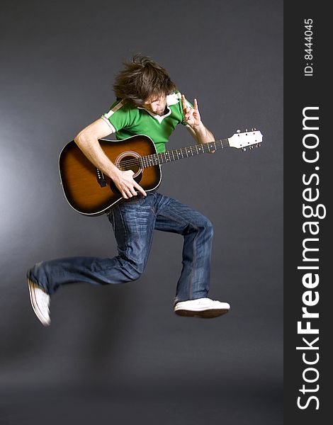 Passionate Guitarist Jumps In The Air