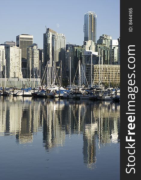 Boats are moored at a harbor in downtown Vancouver, BC Canada. Boats are moored at a harbor in downtown Vancouver, BC Canada