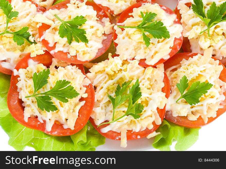 Close-up stuffed tomatoes with cheese and garlic, vew from above, isolated on white