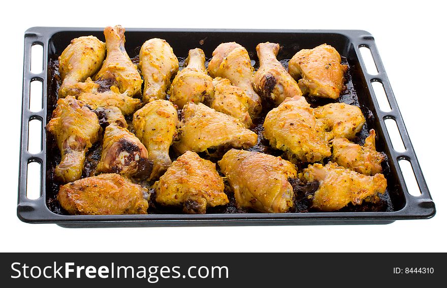 Fried chicken meat on baking sheet, isolated on white