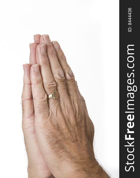 Male hands praying against white background. Male hands praying against white background