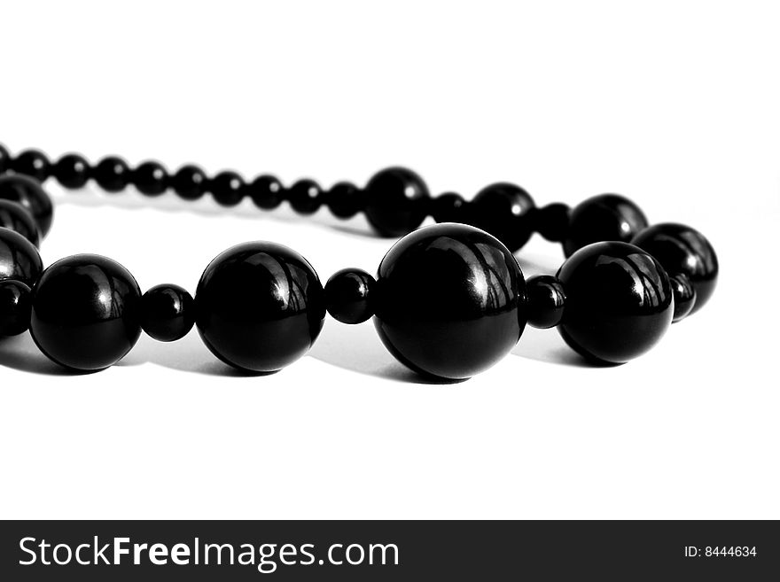 Black pearl necklace isolated on white background